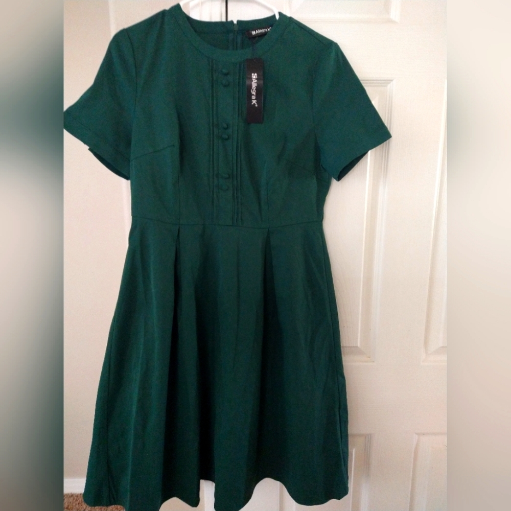 Forest green above the knee dress with sleeves.  Zip back, button closure arms.